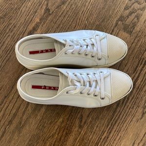White leather platform Prada sneakers with platform and toe detailing